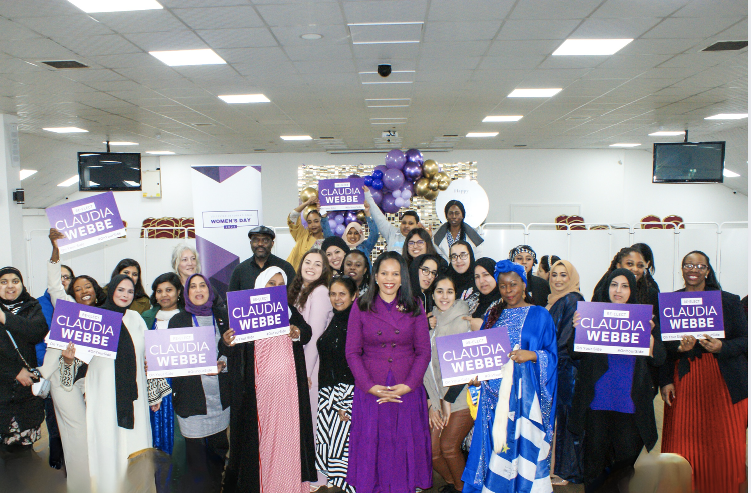 Attendees at Leicester International Women's Day 2024 with Claudia Webbe MP