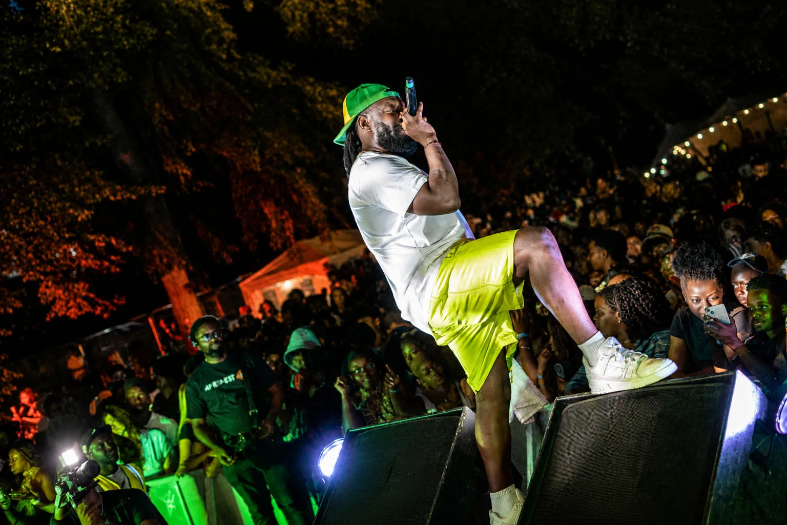 Timaya performing on the barrier to a packed crowd at Afri-Fest East 2026