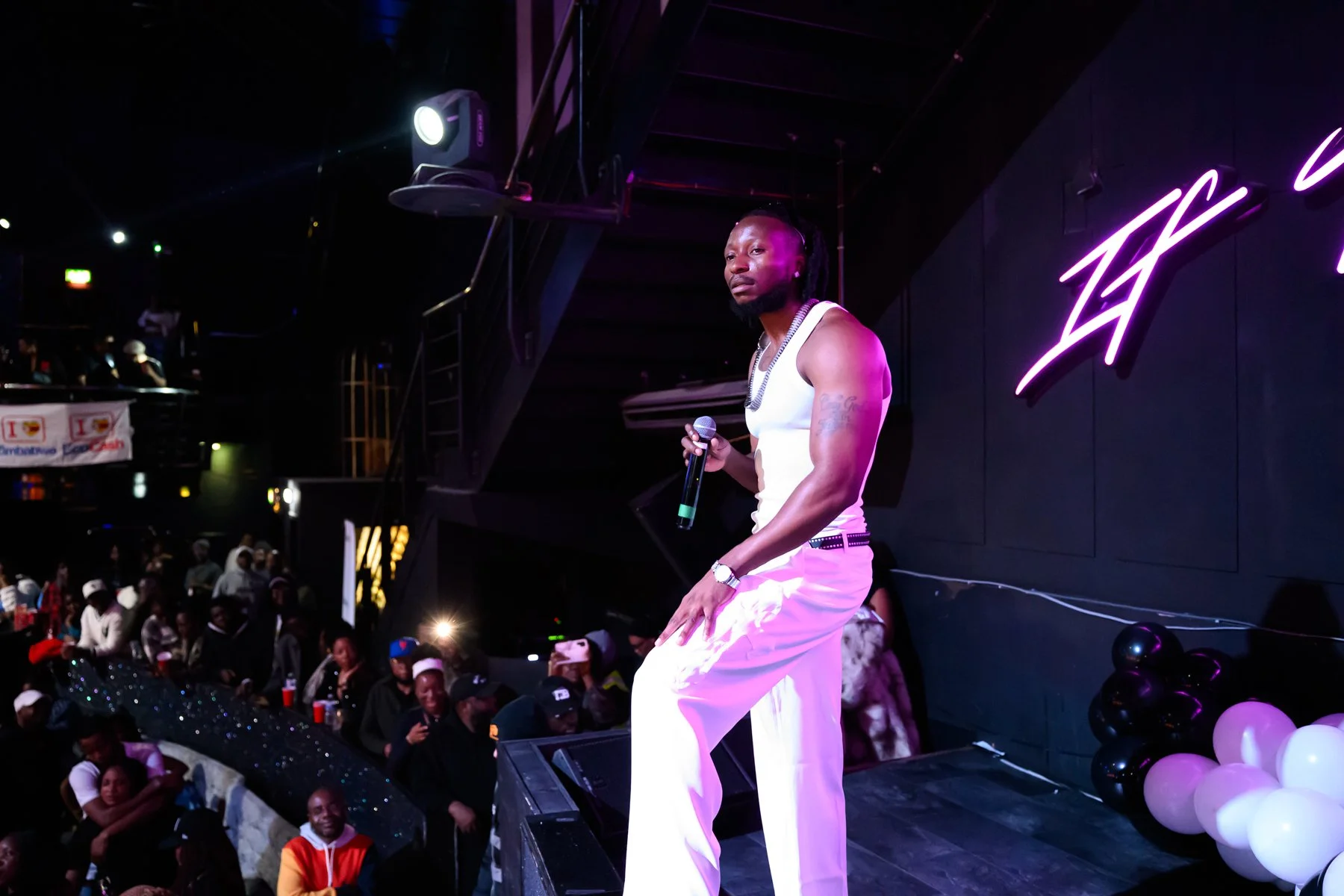 Baba Harare performing on a dark stage during the Jiti GodFather UK tour