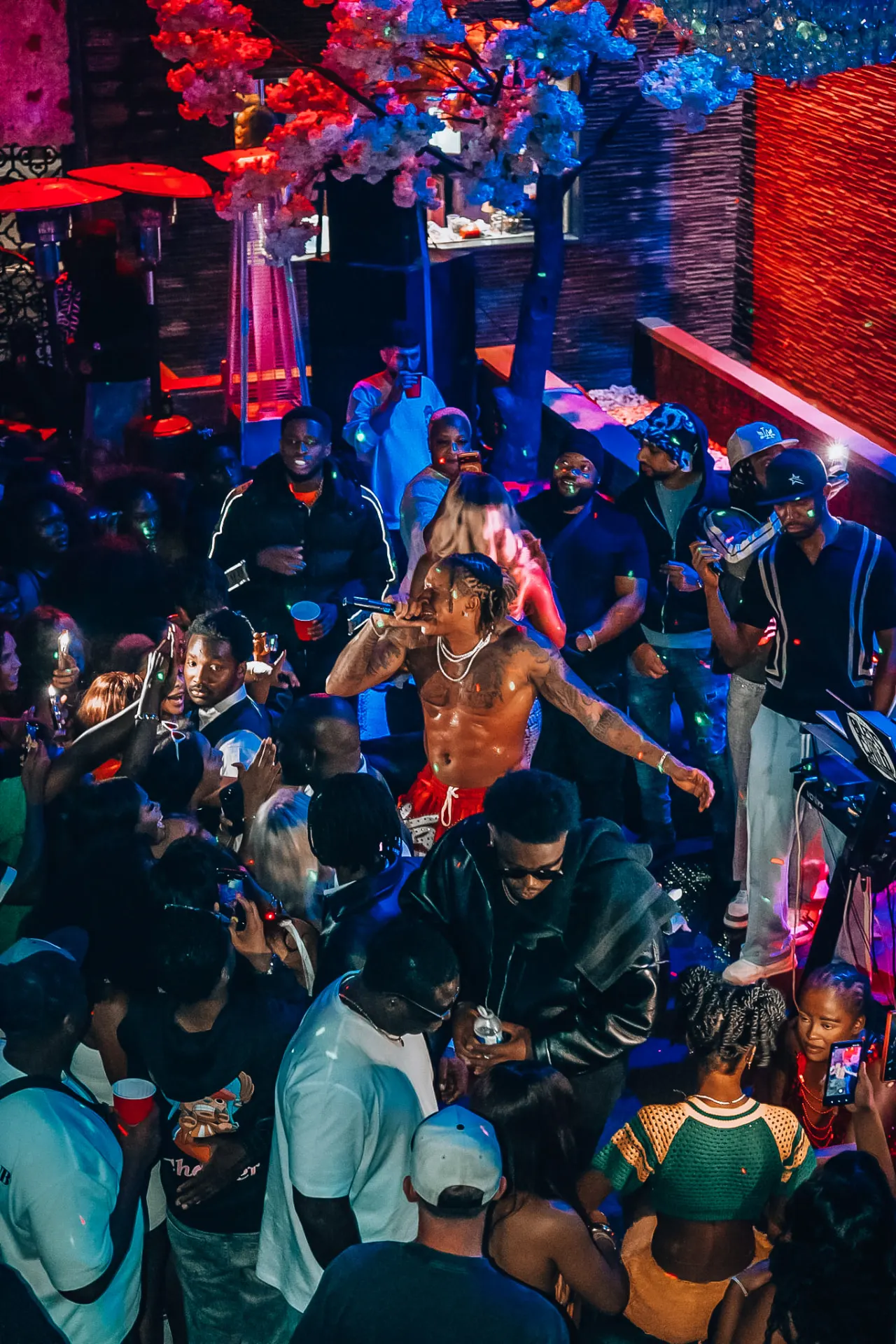 Rotimi performing on the floor surrounded by the crowd at Gate 65