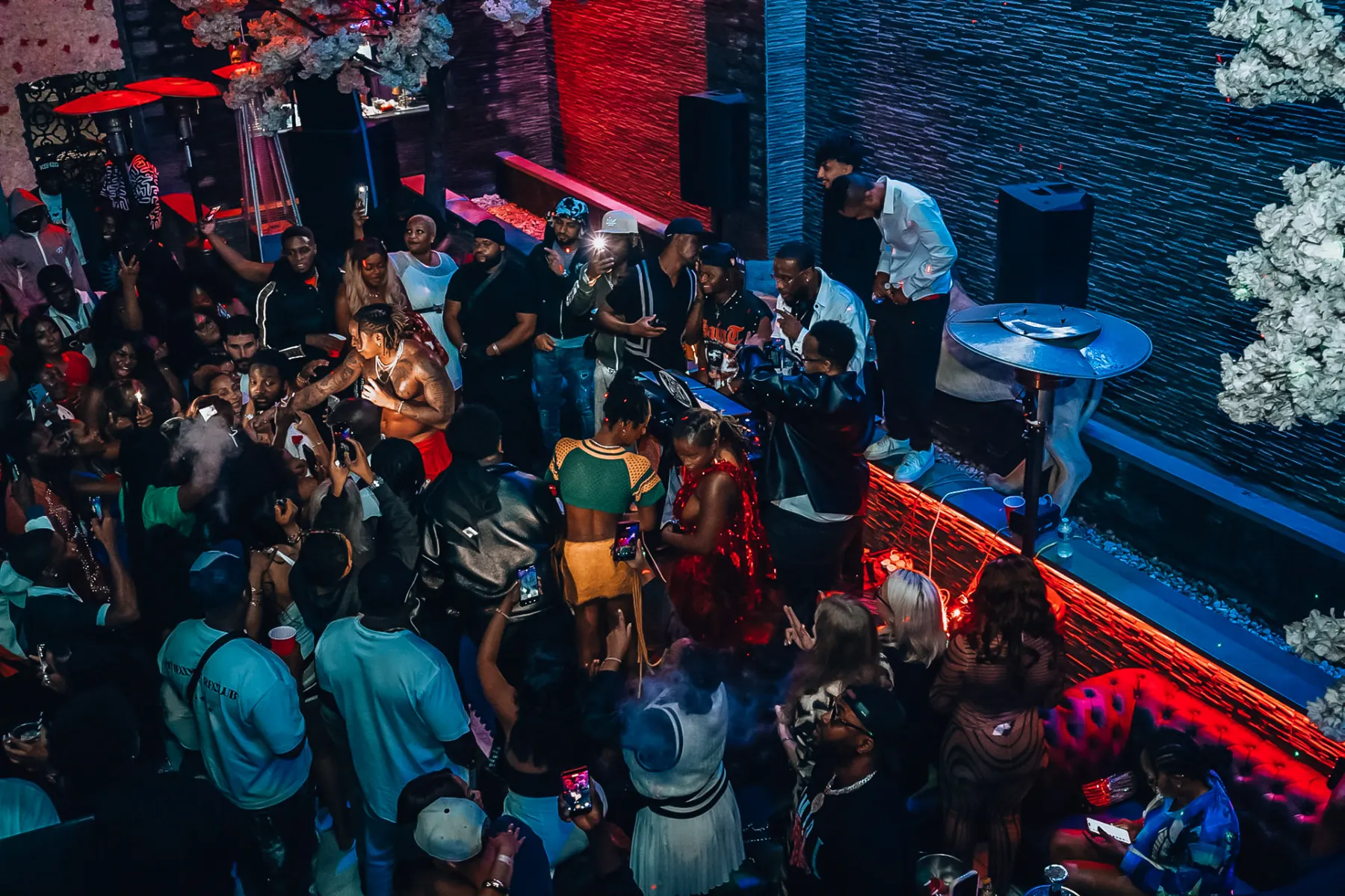 Wide overhead view of a full room at Gate 65 during the Rotimi show