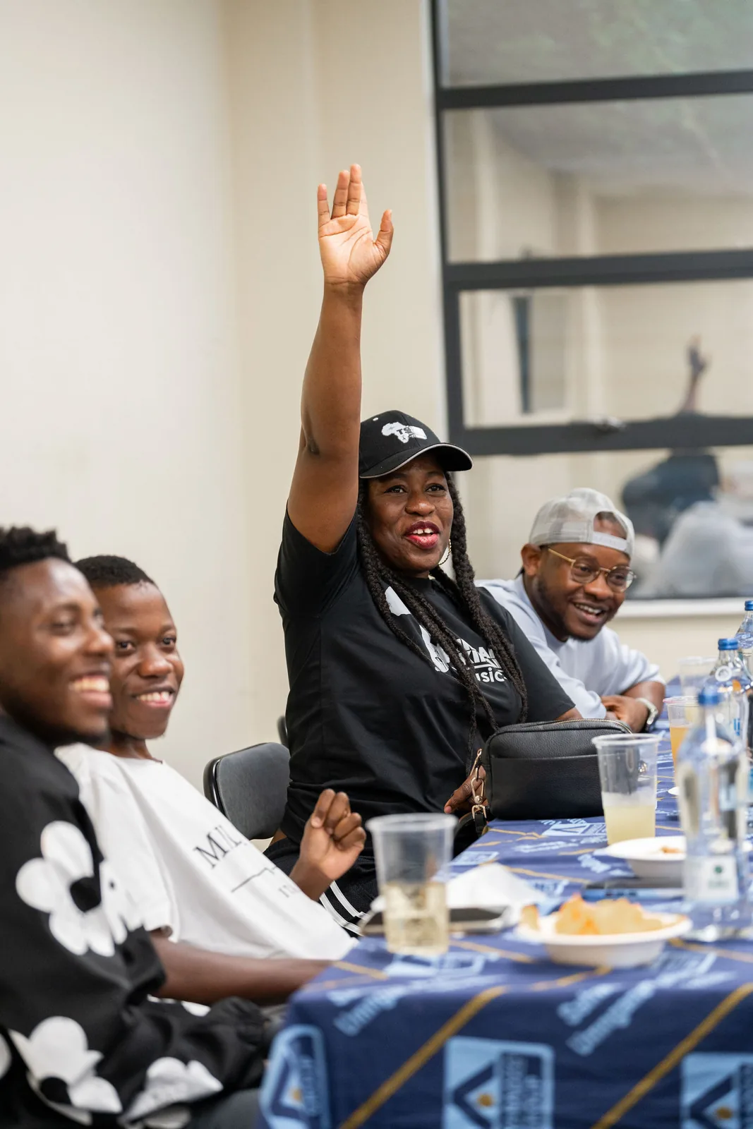 A participant raising her hand during the strategy session