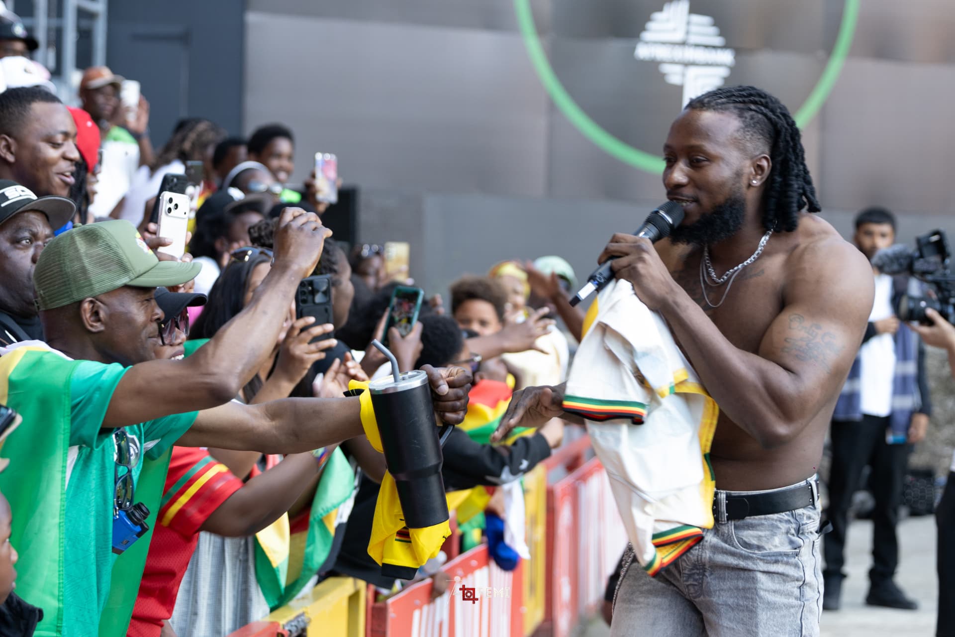 An artist performing to fans at the barrier during Unity Cup 2026