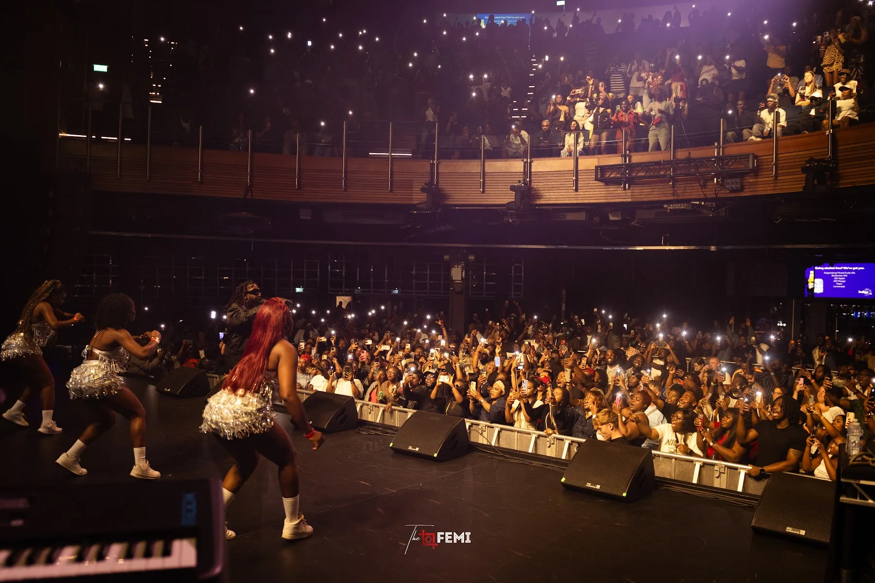 Packed crowd at indigo at The O2 seen from the side of the stage