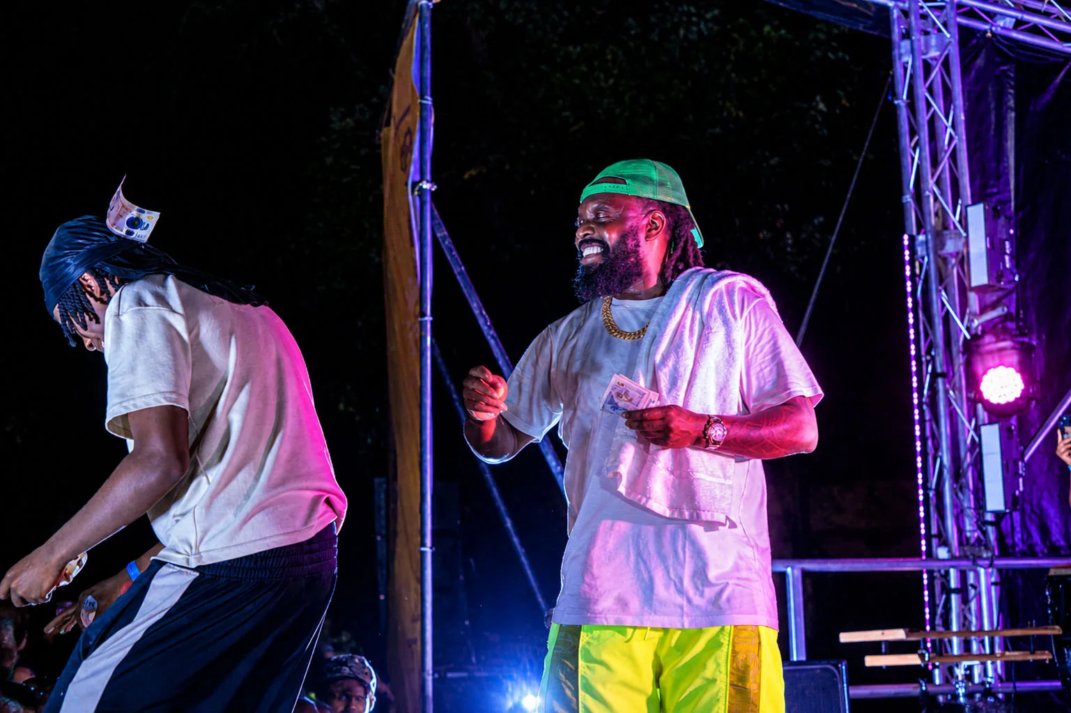 Timaya on stage with a guest performer during the set