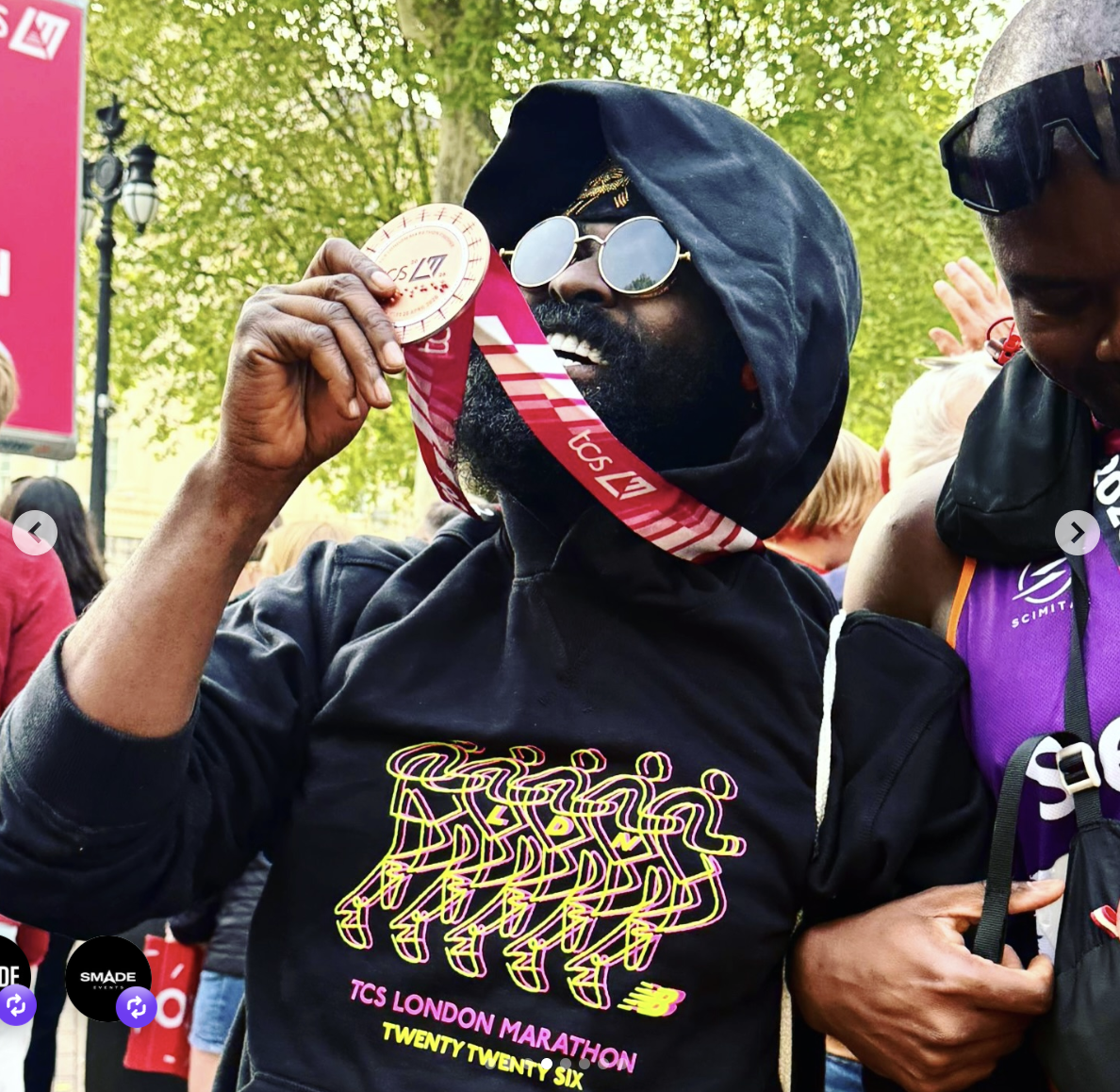 Dr King SMADE holding his medal at the 2026 London Marathon